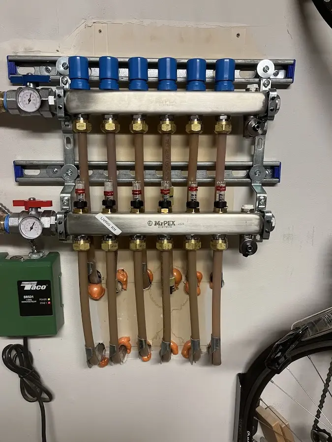 Plumber performing Water Heater Repair at a residential property in Oak Grove